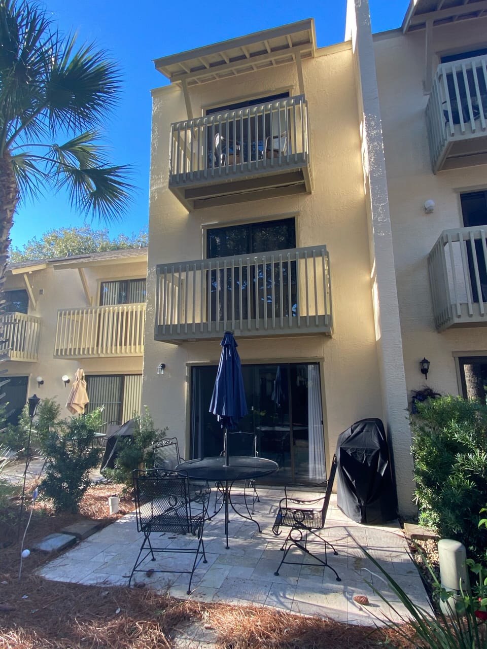 Patio with table and gas grill 