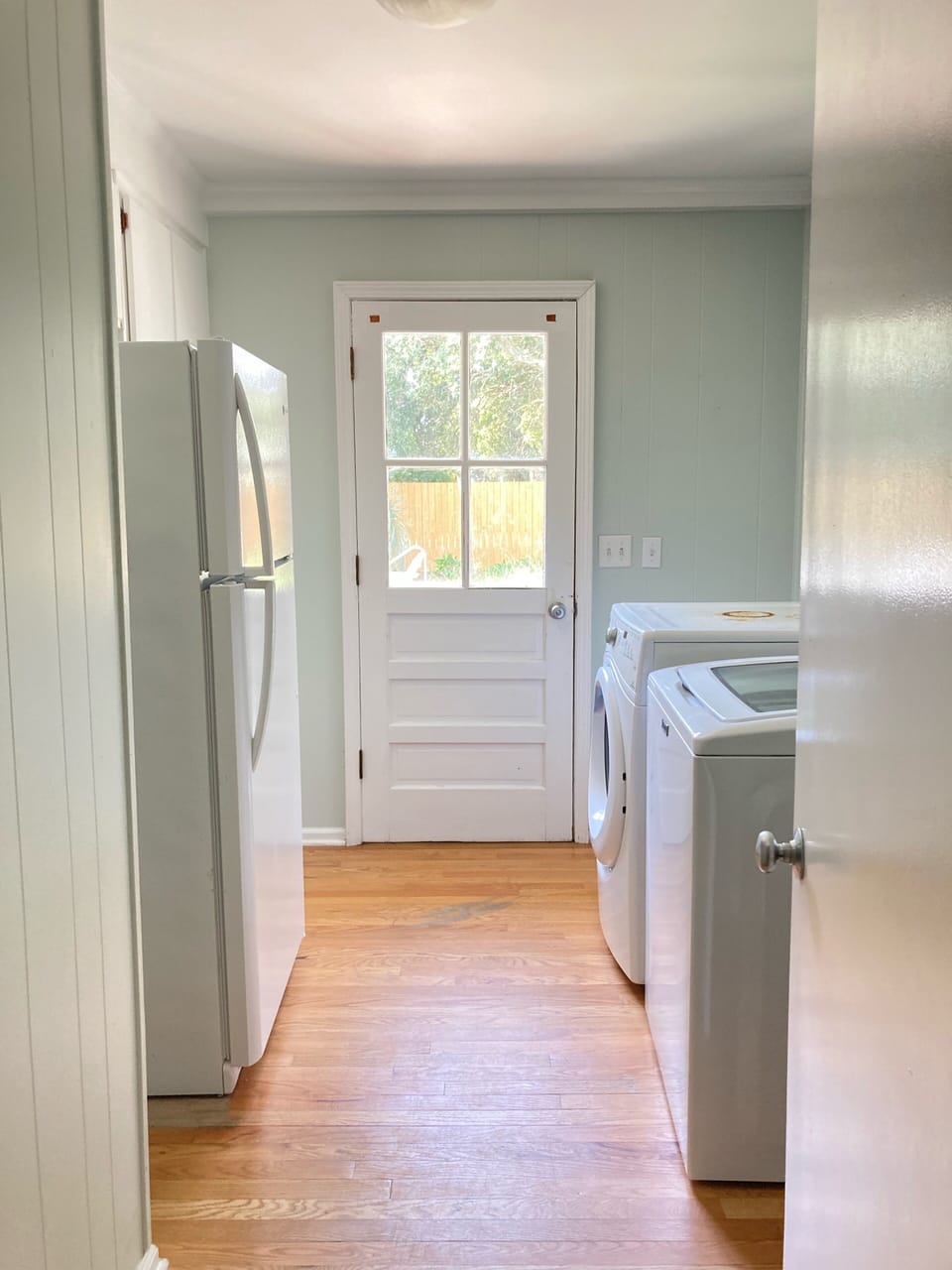 Laundry room with extra refrigerator 