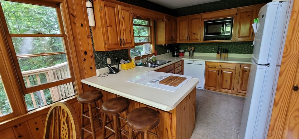 Breakfast bar seats 3 adjoining dining area