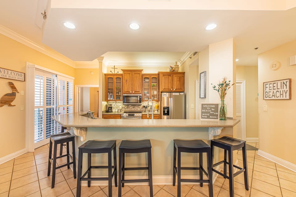 Beautiful and fully stocked kitchen with all new stainless appliances.