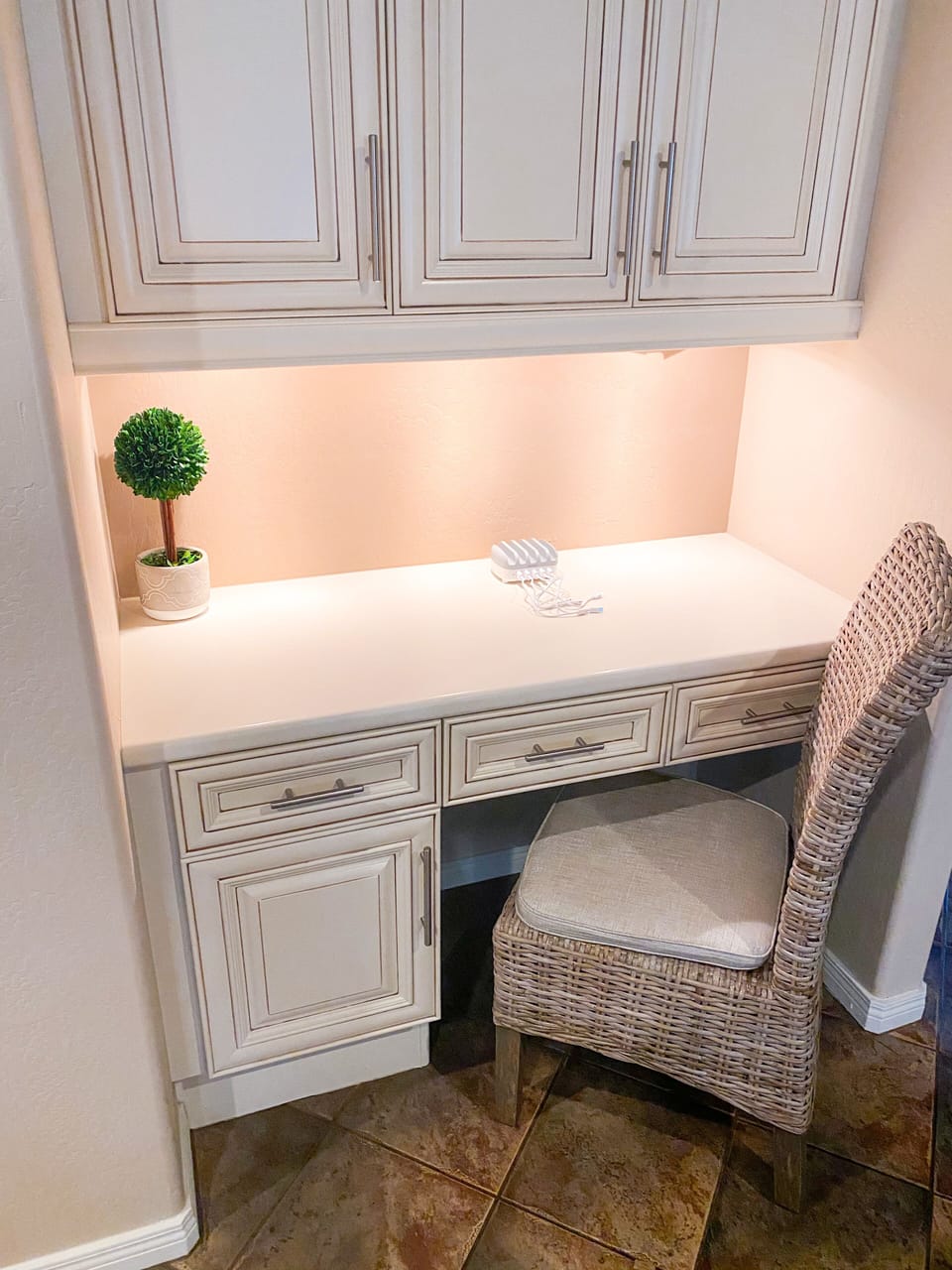 Desk space in living room w/charging station.