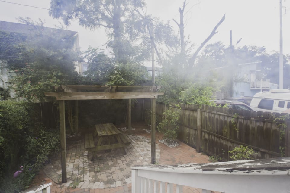 The backyard is fenced in for privacy.