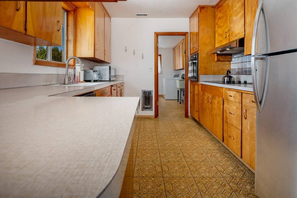 The kitchen boasts plenty of counter space and is fully stocked.