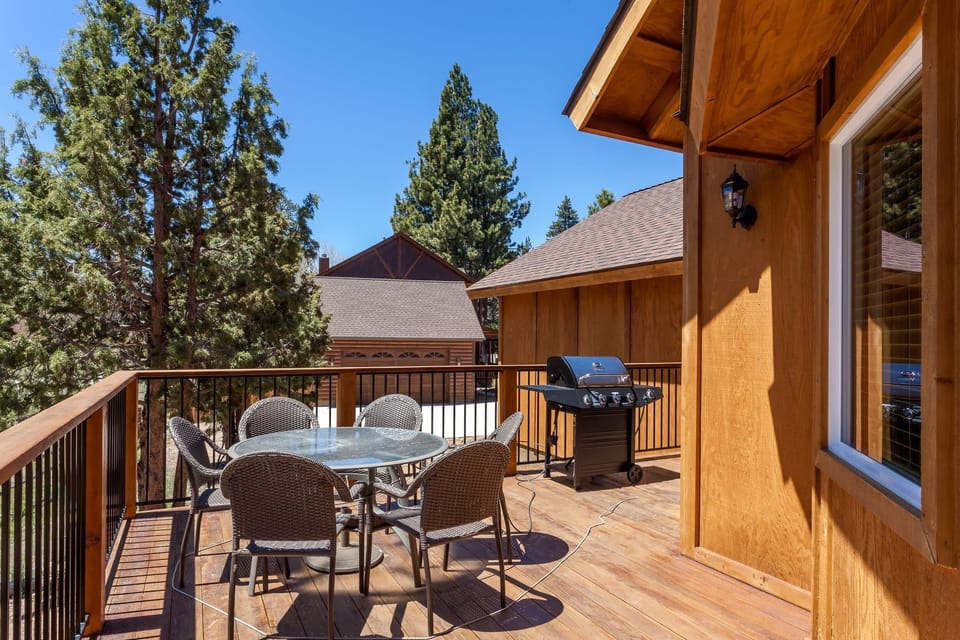 Deck featuring LED Sand BBQ with sitting area.