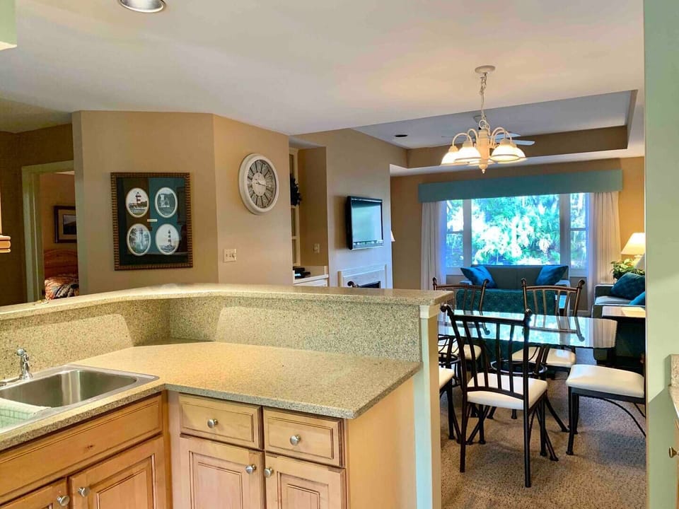 View of kitchen, dining area, den