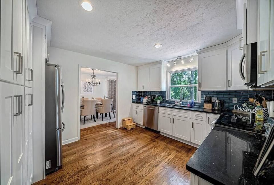 Refridgerator; oven & stove; cooking utensils; Plates, bowls, & cups (glasses and mugs).