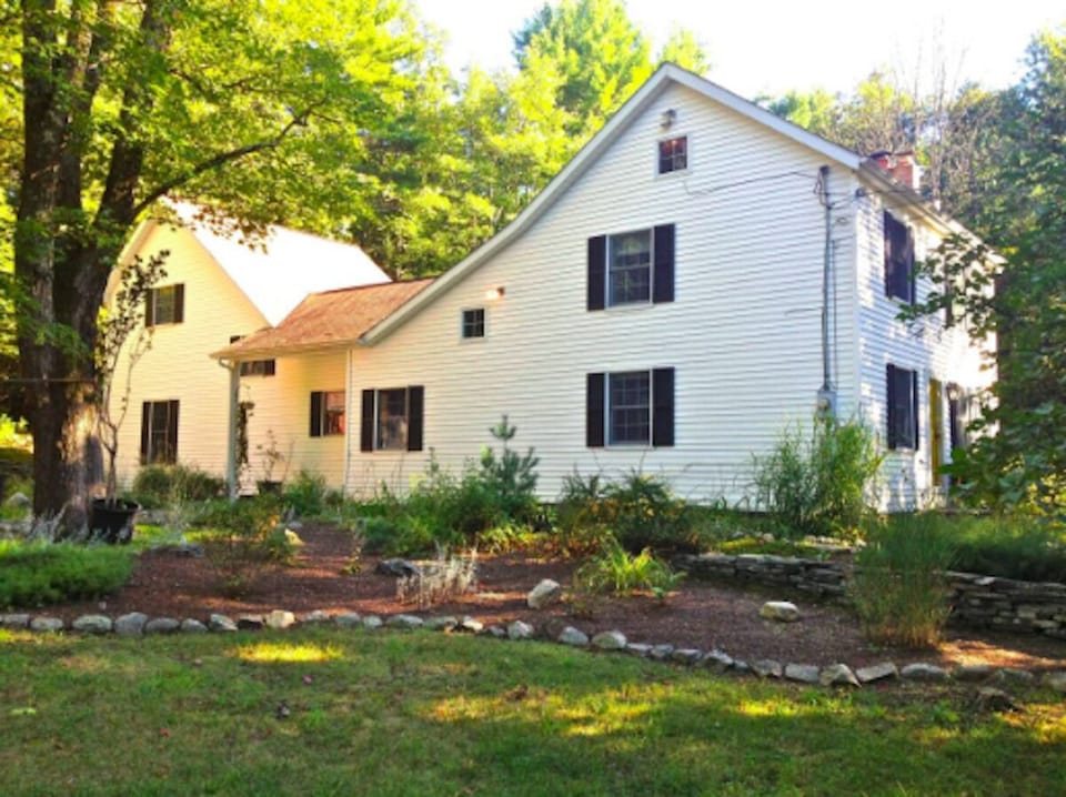 House has mature landscaping.