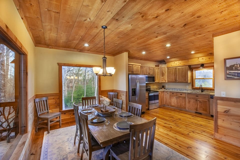 Spacious dining area accommodating eight guests, ideal for family dinners and group gatherings