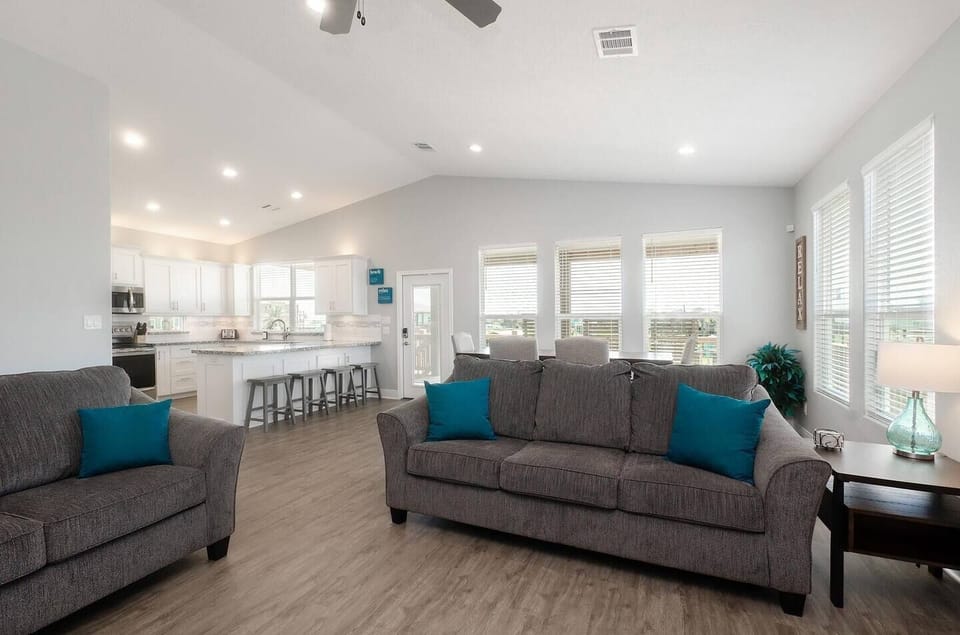 Gather in the wide open-concept space, perfect for meals, games, and laid-back coastal evenings.