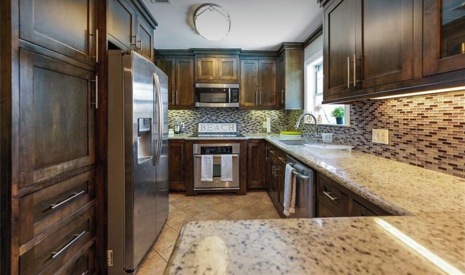 Modern Kitchen with granite countertops, appliances  