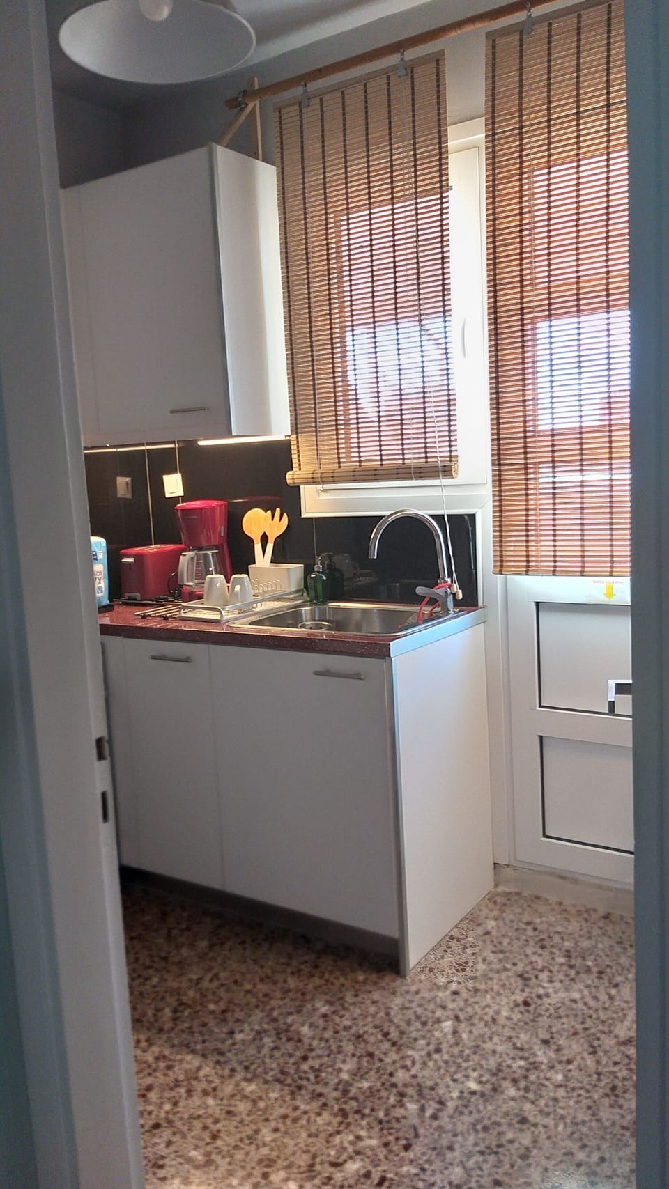 Kitchenette, functional with preserved retro mosaic floor
