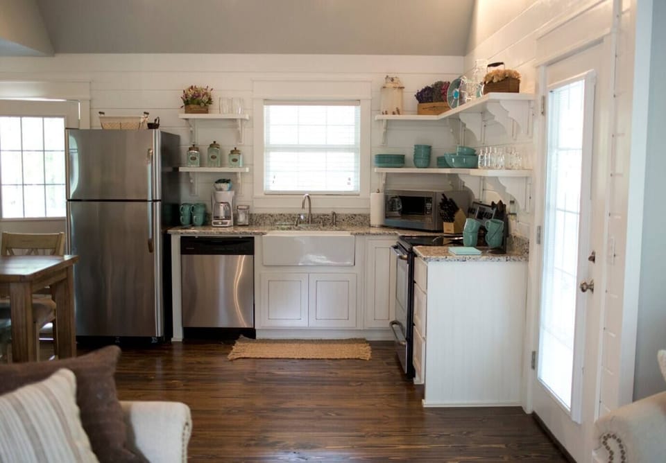 Open shelving in farmhouse style country kitchen in vacation rental