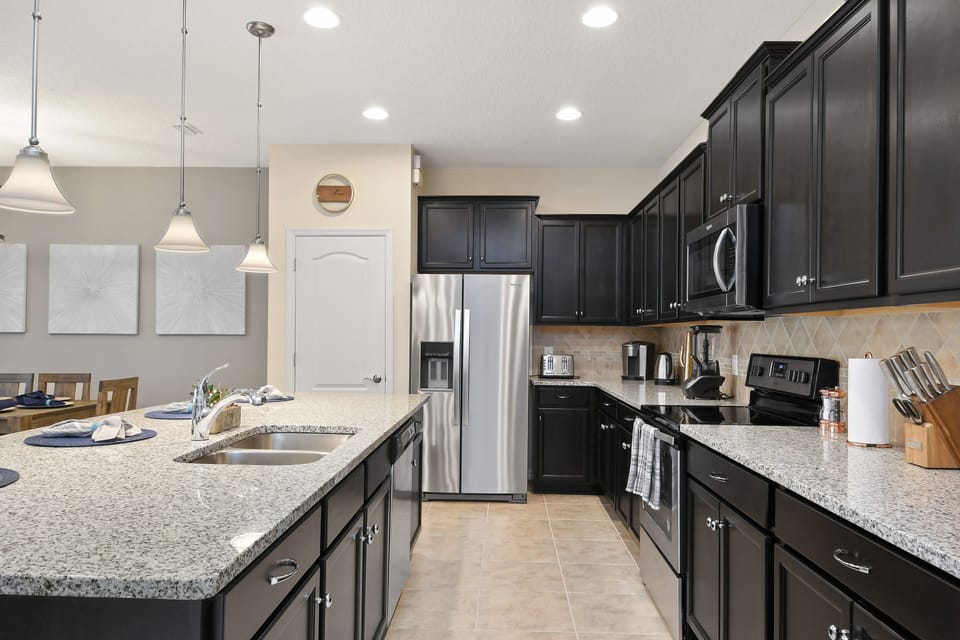 View 3 of stunning modern style kitchen with microwave, stove, and oven