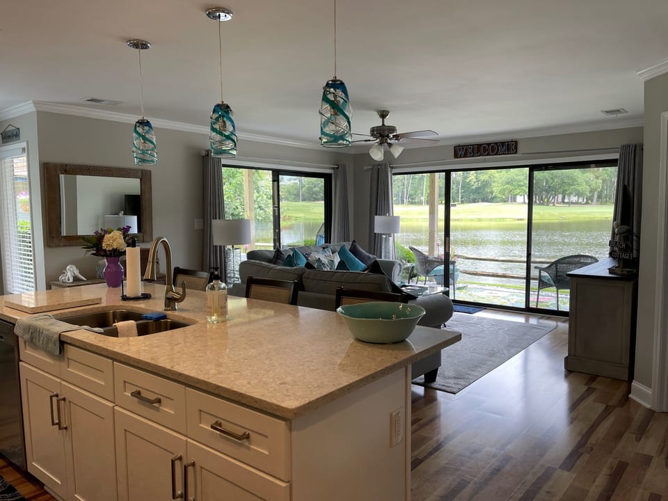 Living room with view of lake and golf course
