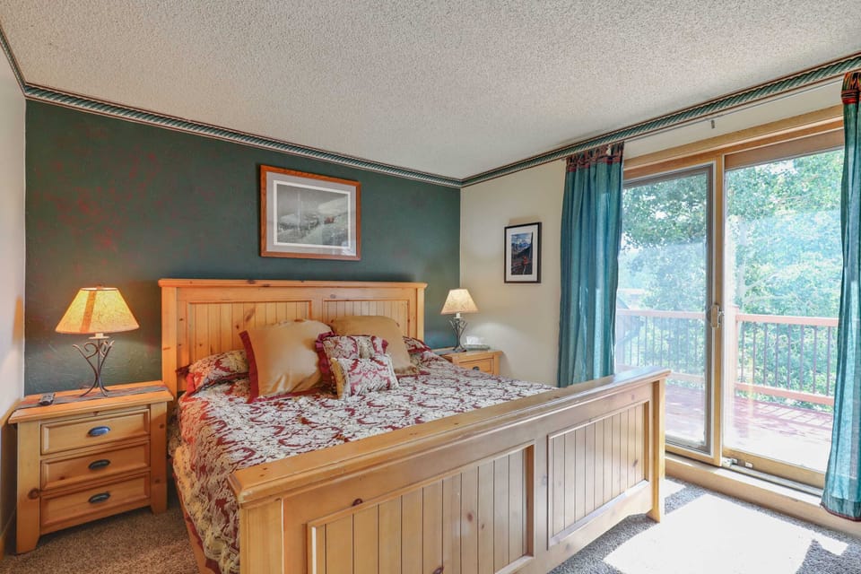 Primary bedroom with king bed, private balcony, and en suite bathroom