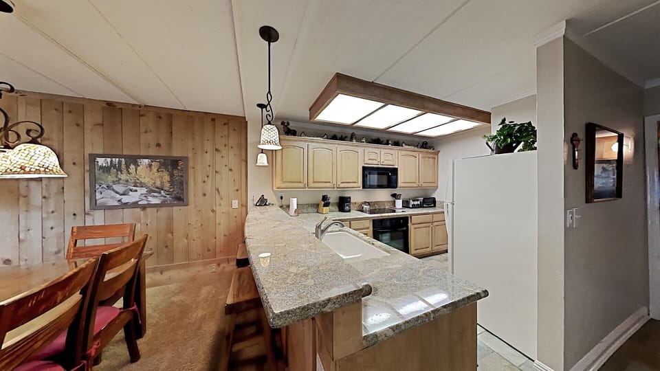 Counter Seating And Full-Sized Kitchen