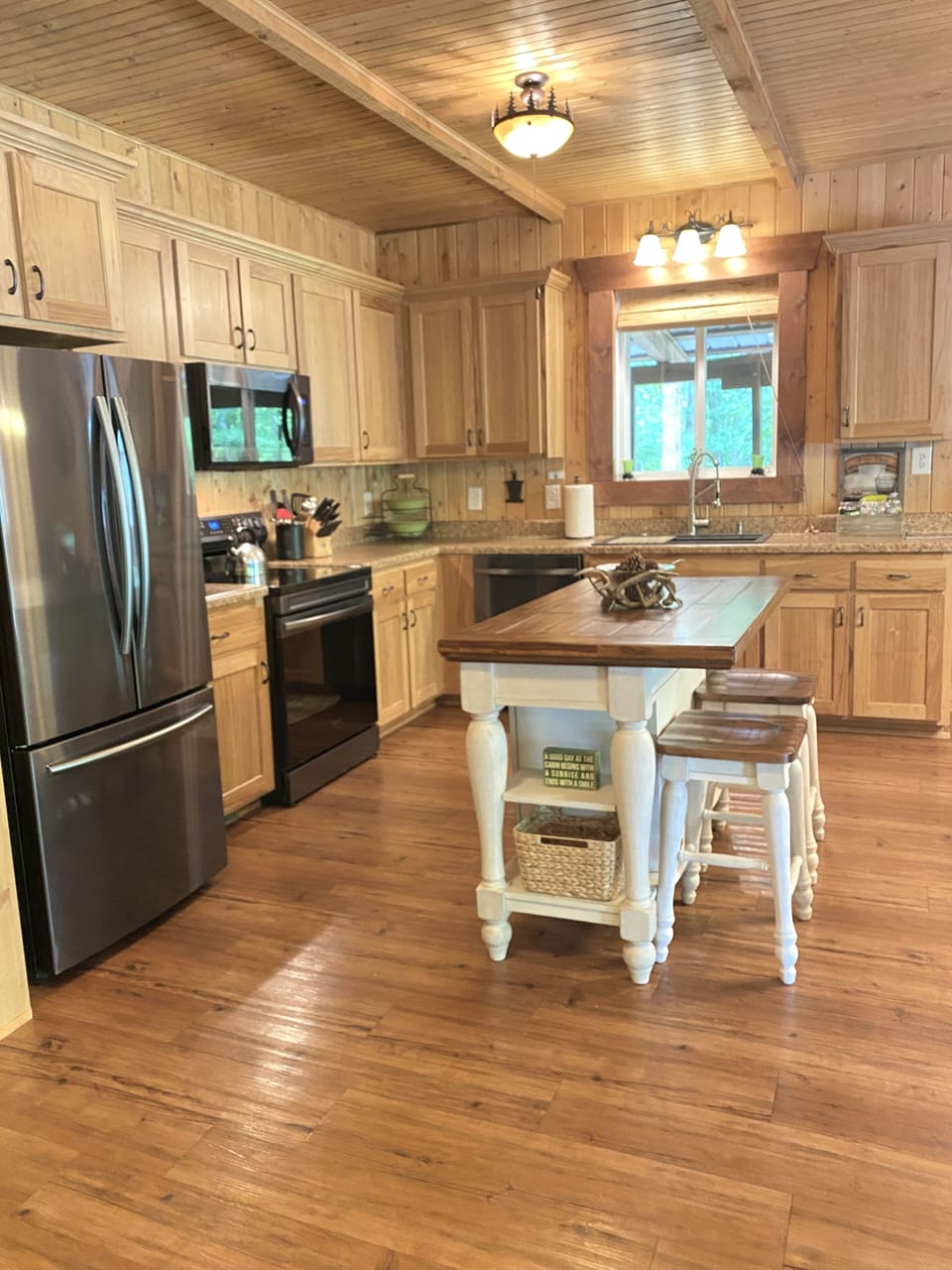 Kitchen with upgraded appliances and island.