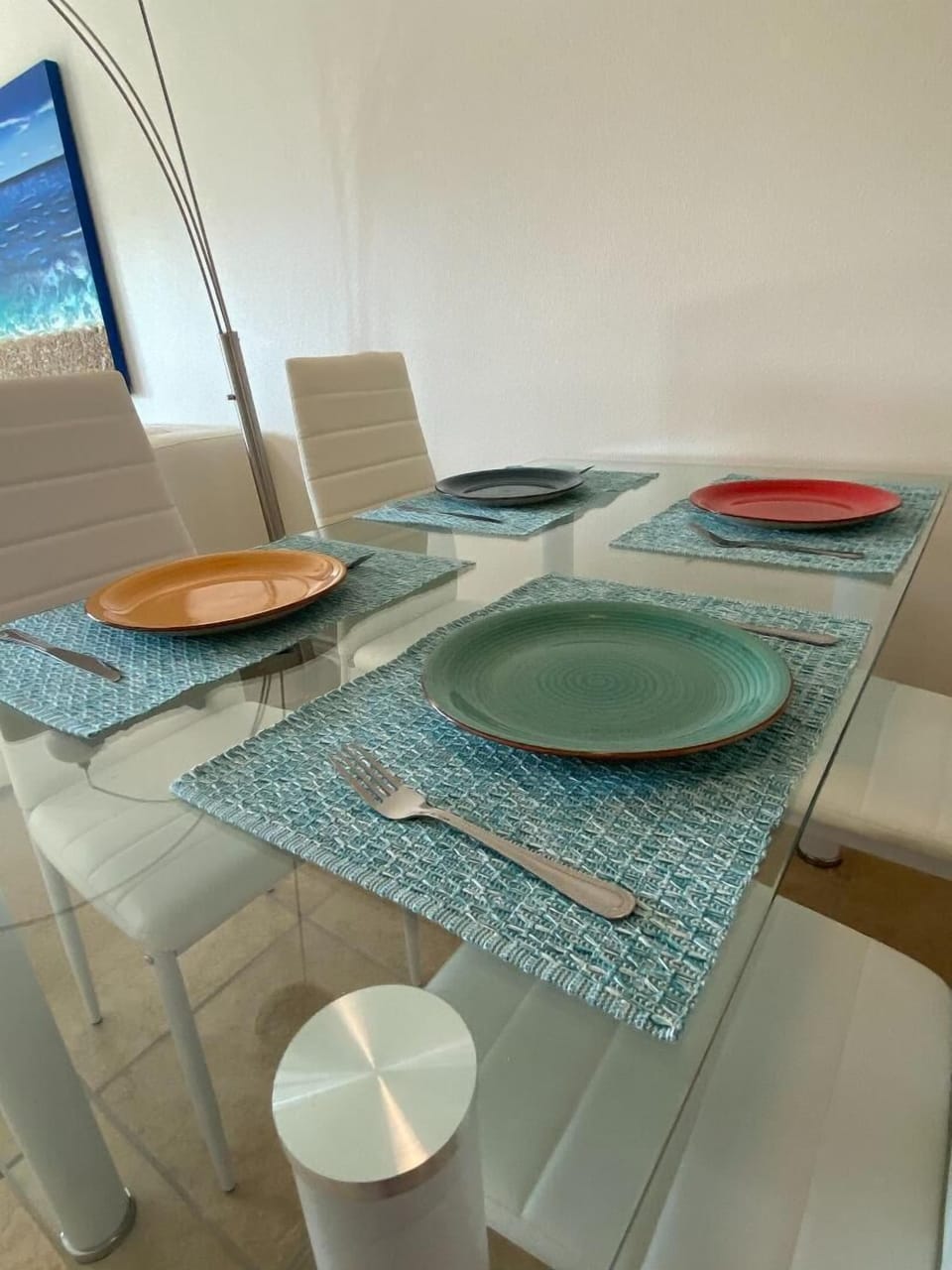 four of the eight place settings for dining 