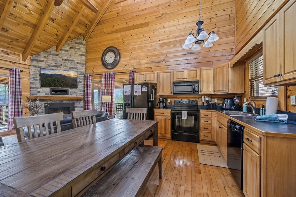 Open concept kitchen stocked with all the essentials, including a Keurig/drip coffee maker and air fryer.
