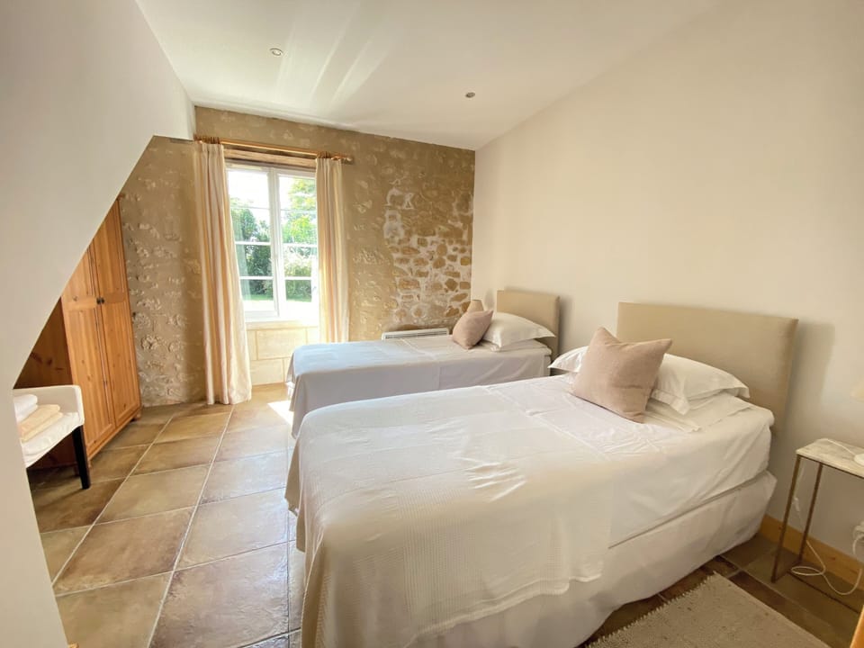 Downstairs twin bedroom which has it's own bathroom upstairs. 