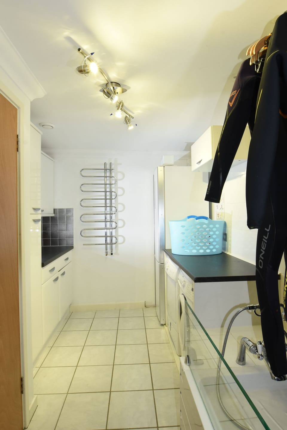 Large utility room with wet suit wash area. Washing machine and tumble dryer