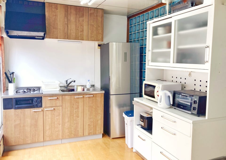 Spacious kitchen with kitchen appliances.