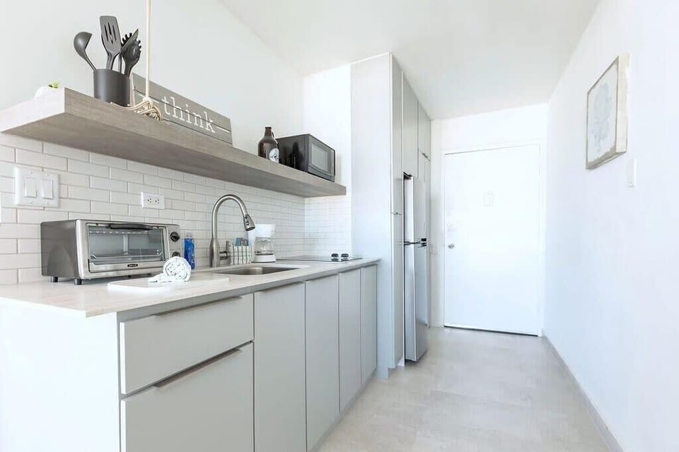 Features mini over, microwave and full fridge