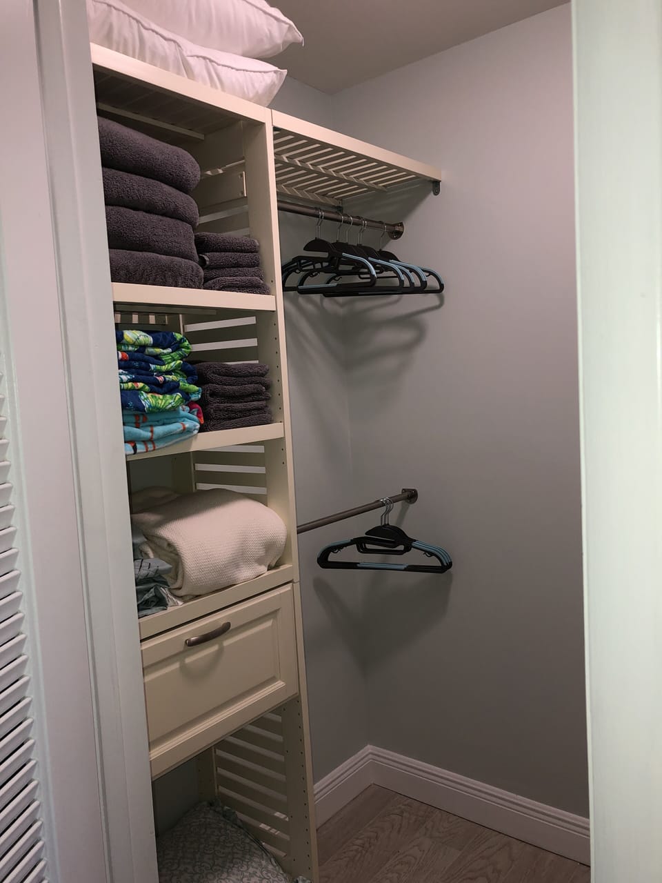 Master closet with storage, guest bath towels, beach towels, blankets, pillows