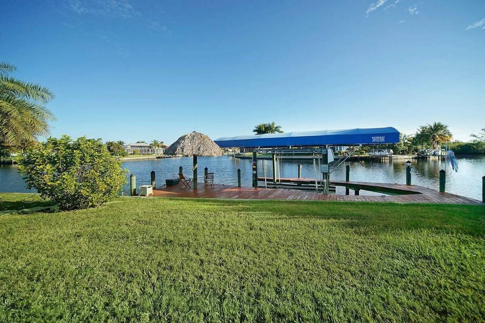 Villa Dolphin Bay - Boat Deck with Tiki Hut and Canal View