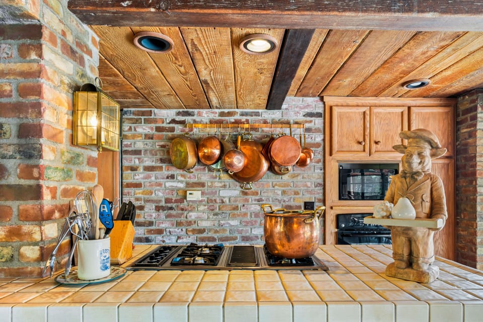 French Cooper pots and pans. Microwave, electric oven, and gas stove top.

