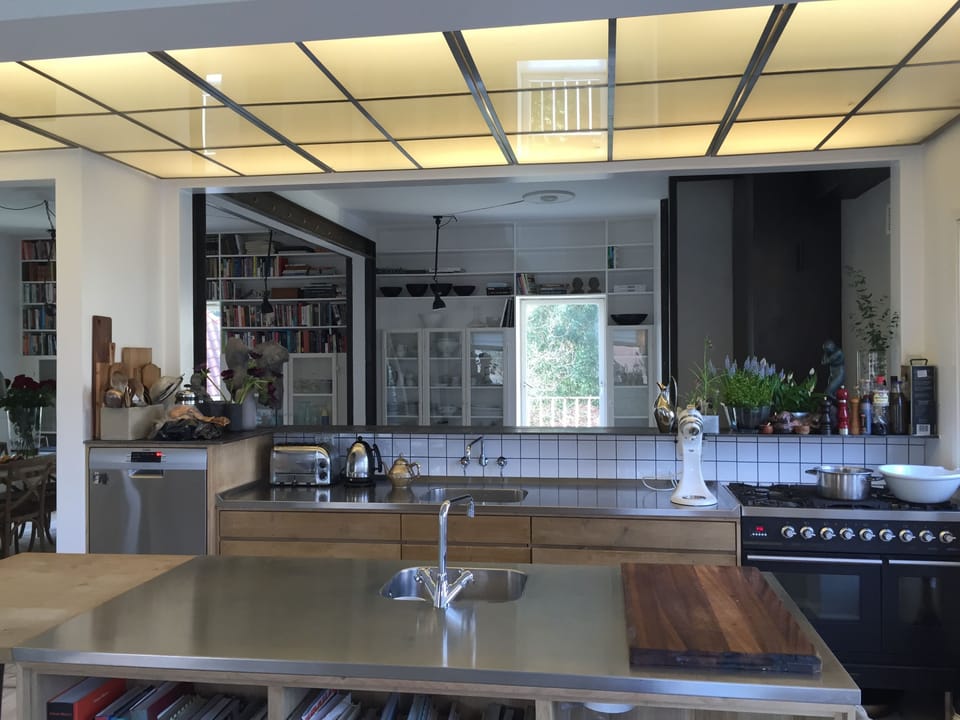 The kitchen and the bar facing the livingroom