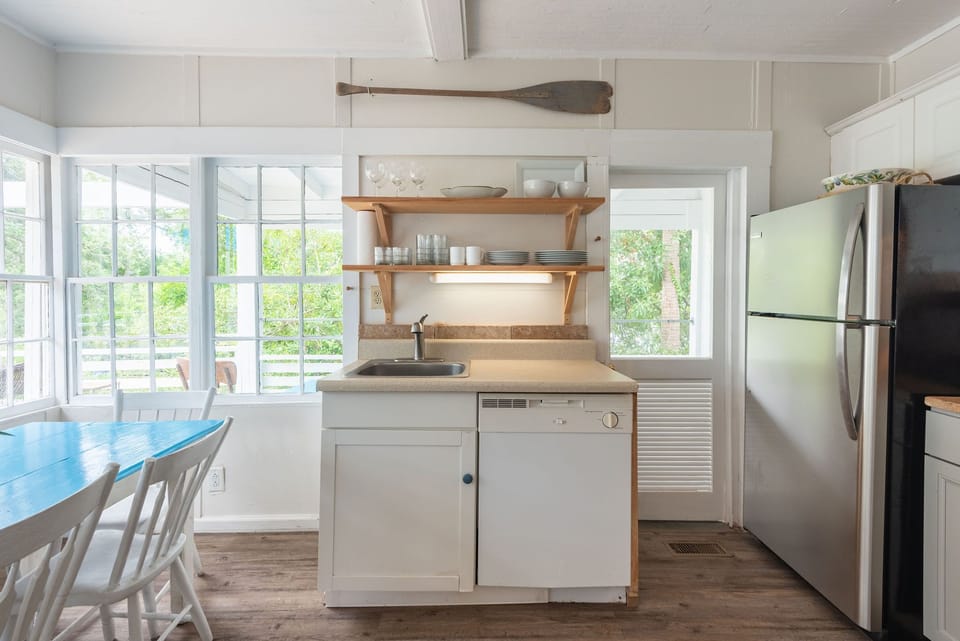 There are lots of windows bringing abundance of natural light into the kitchen