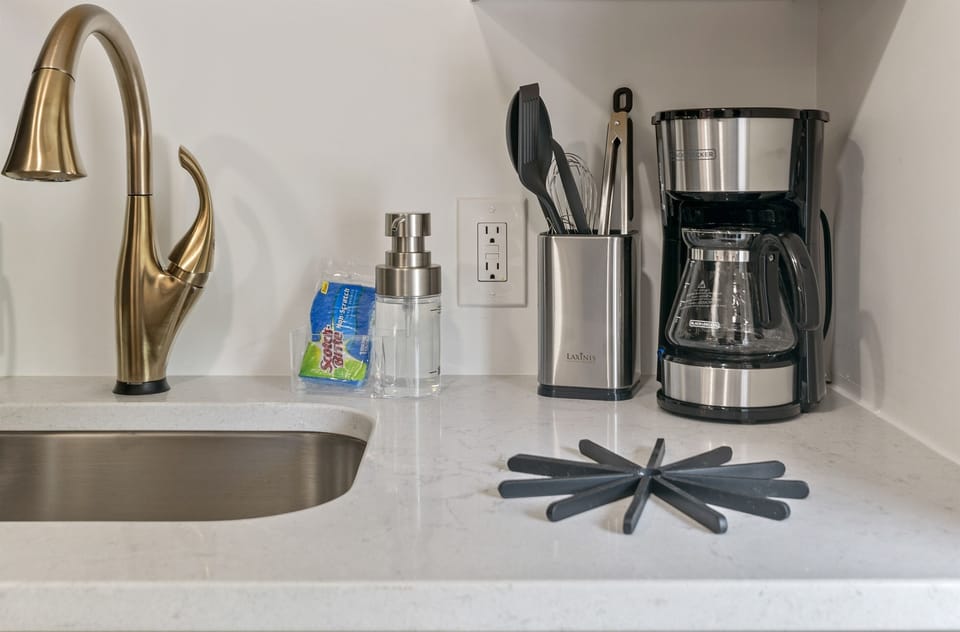 Coffee maker has been replaced with a Keurig. Starter supplies of K-cups, sugar, creamer provided.