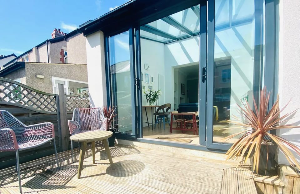 Decked porch and modern seating area, south facing with sunshine all day.