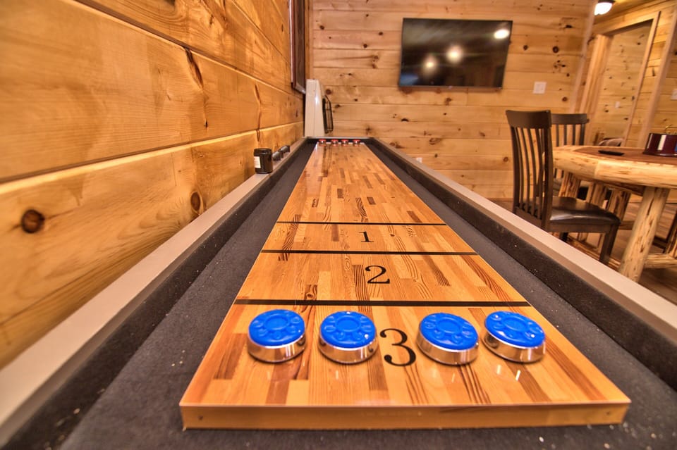 12 Ft. Shuffleboard Table Located In The Game Room.