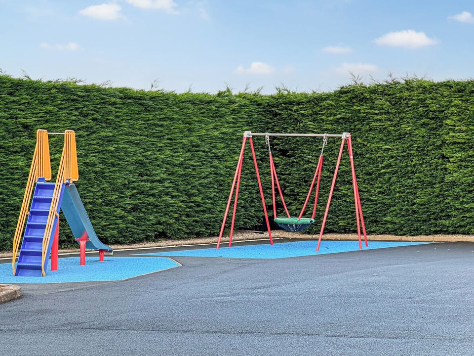 Children&rsquo;s play area | Ysgubor - Rhyddallt Ganol Cottages, Caethro, near Caernarfon
