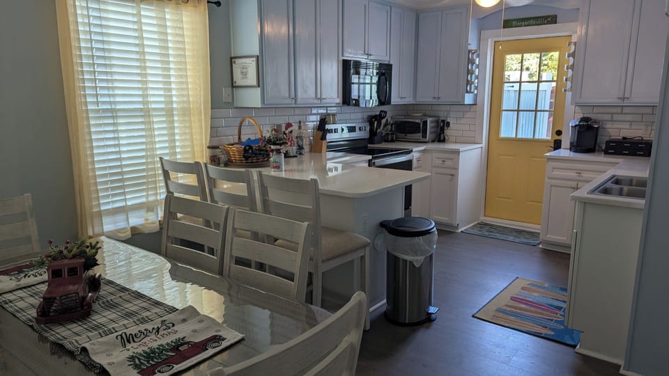 Dining area and kitchen - new table/chairs/bar stools Oct 2025 