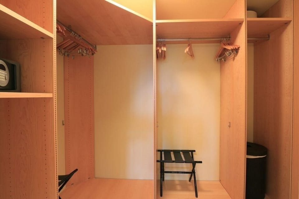 Master Bedroom walk-in closet.  There is a programable safe in this closet. 