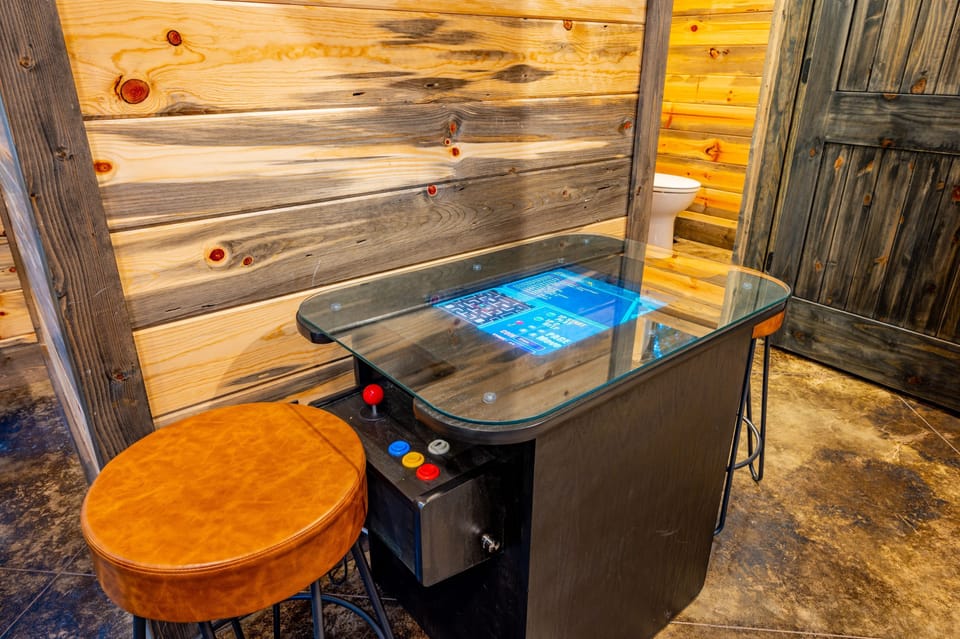 Challenge friends and family to pool, shuffleboard, or classic arcade games in the game room.