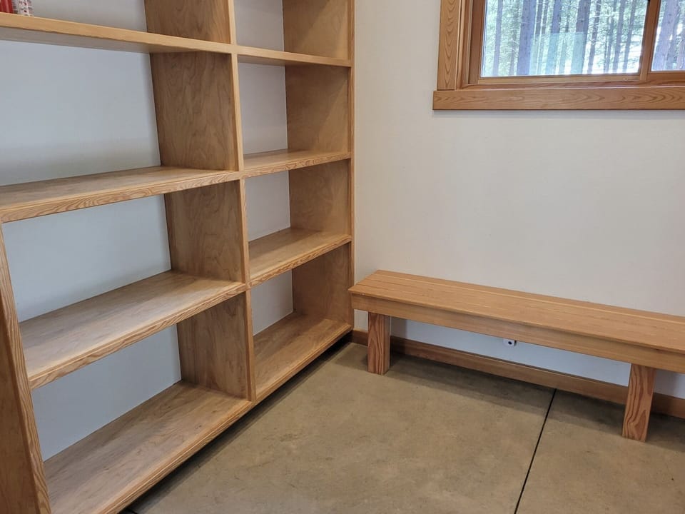 Large mud room with plenty of space for coats, shoes, etc. 