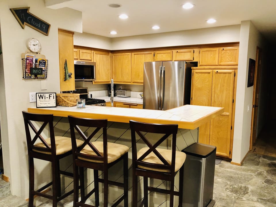 Additional seating at the bar. Kitchen has high-end appliances