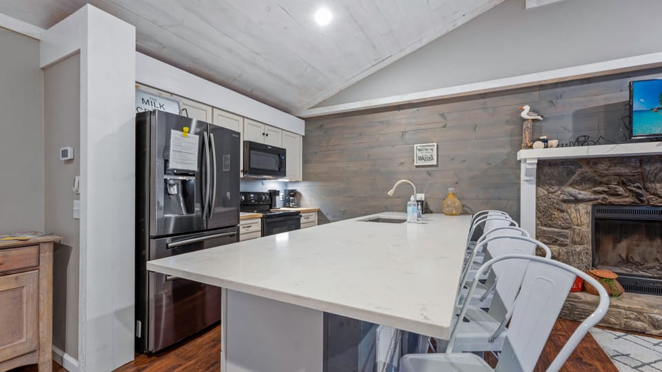 A view of the kitchen with stainless steel appliances