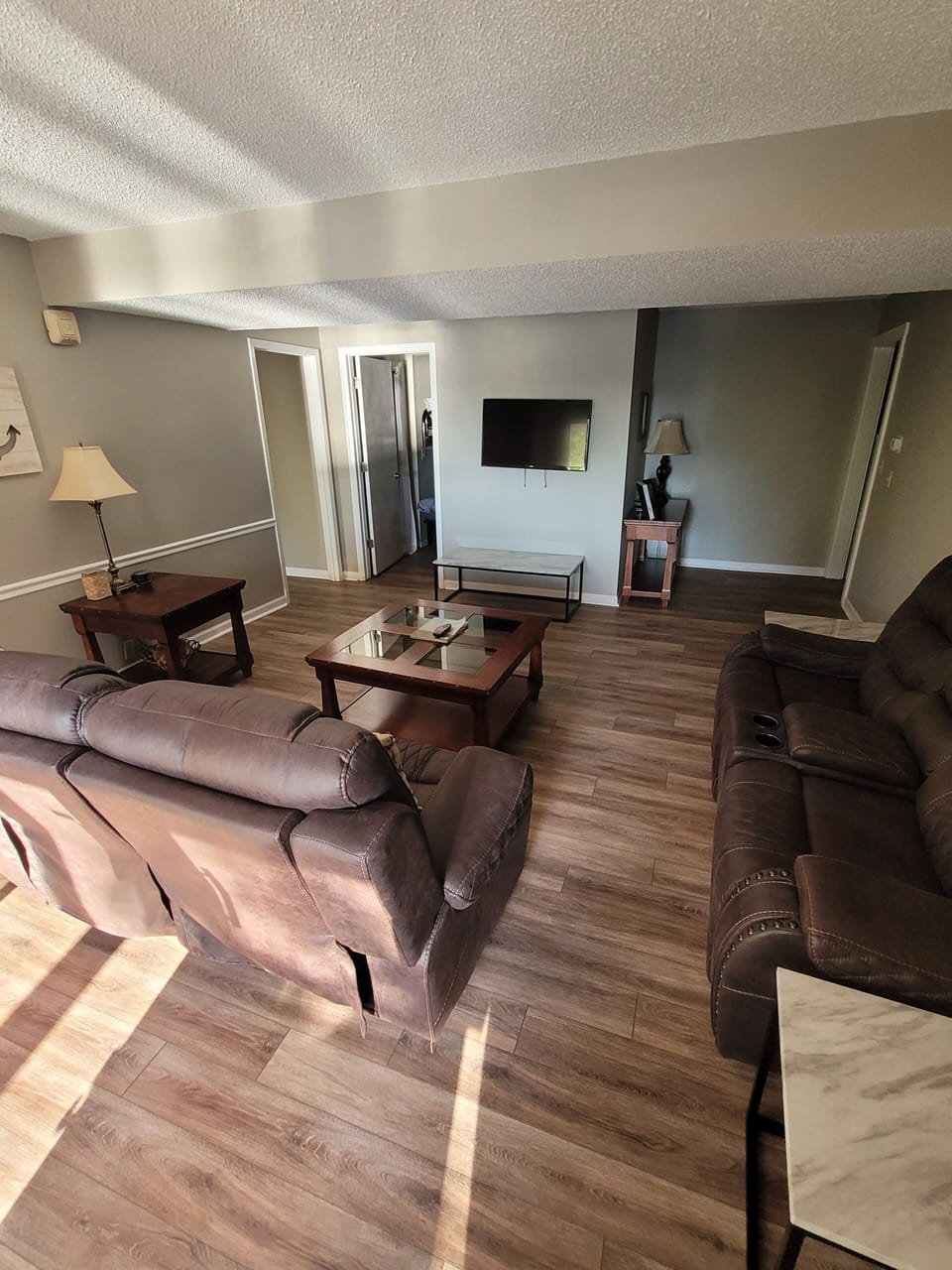 Downstairs Living Room with recliners and cable TV