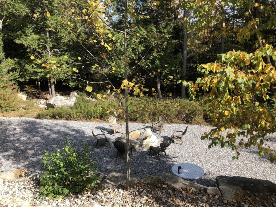 Large area for fire pit, corn hole and group gatherings.