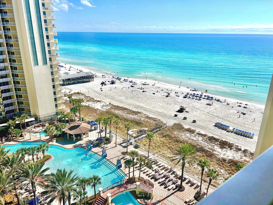Beach and pool view from our balcony