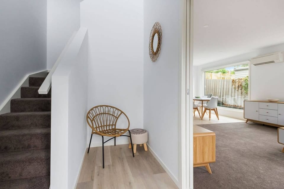 The staircase features a cosy nook with additional seating beneath, providing a perfect spot for reading or a quiet retreat.






