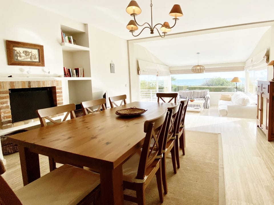 Bright dinning/living room with sea views