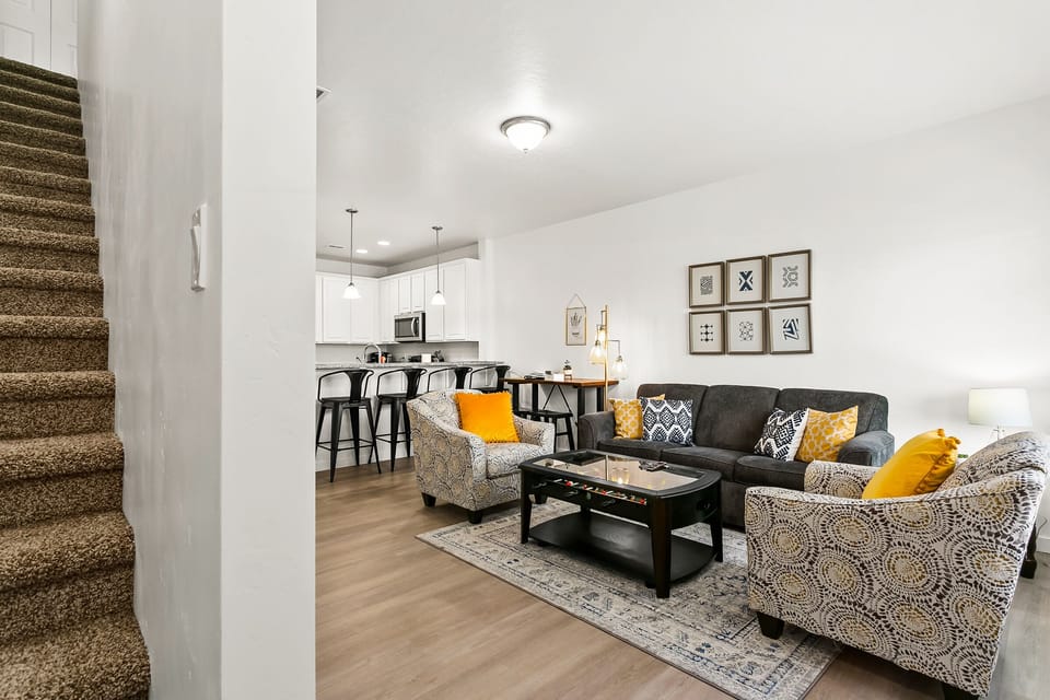View of living room from entrance and stairs.