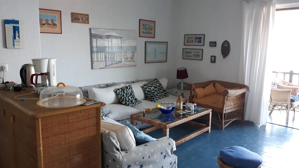 Angle of the living room  with the sofas and the comfortable armchair