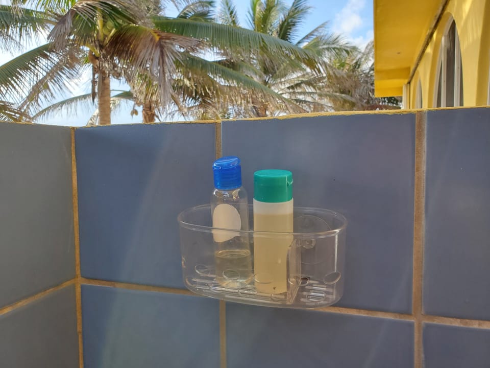 Taking a shower on our beach! After swimming enjoy a beach shower